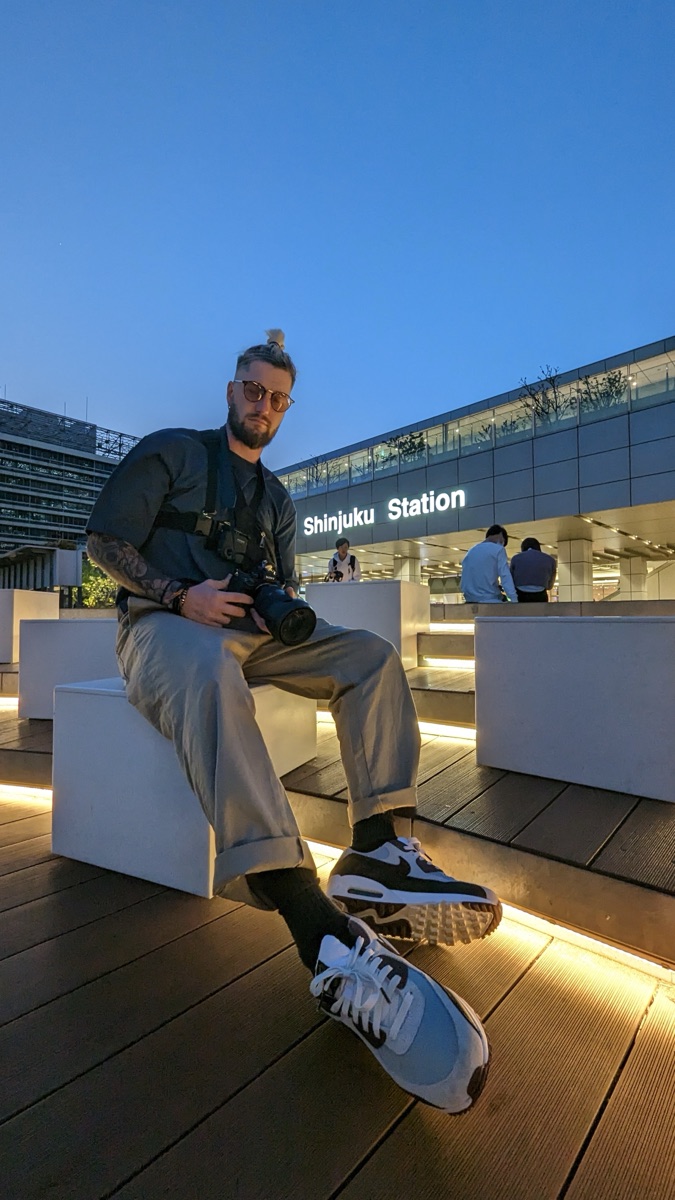 Jacob shooting at Shinjuku Station at dusk